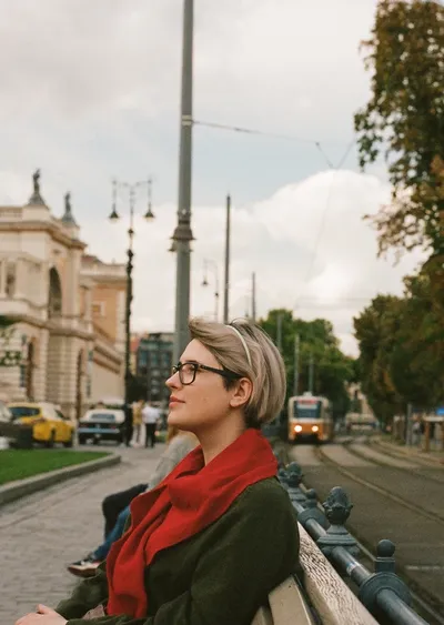 Girl with a tram in the background